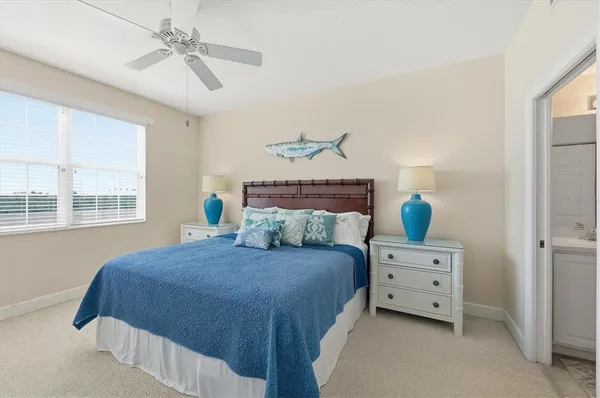 a bedroom with a bed dresser and a window