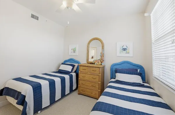 a bedroom with bed and wooden floor