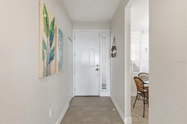 a view of an entryway with wooden floor