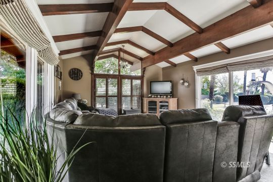 1509 Welcome Way Ridgecrest, CA 93555 - Photo 15 of 50 a living room with furniture tv and a large window