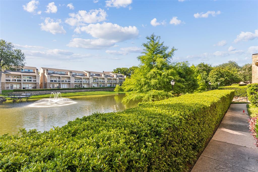 a view of a swimming pool with an outdoor seating and a yard
