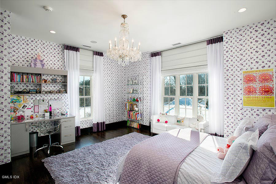 547 Lake Avenue Greenwich, CT 06830 - Photo 15 of 26 a bedroom with furniture and a chandelier