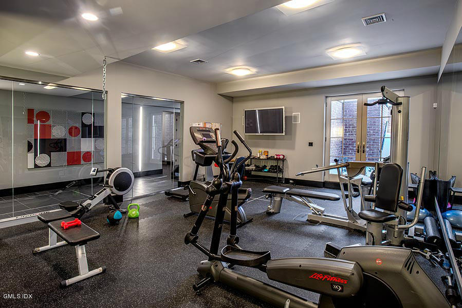 547 Lake Avenue Greenwich, CT 06830 - Photo 20 of 26 a room with gym equipment and mirror