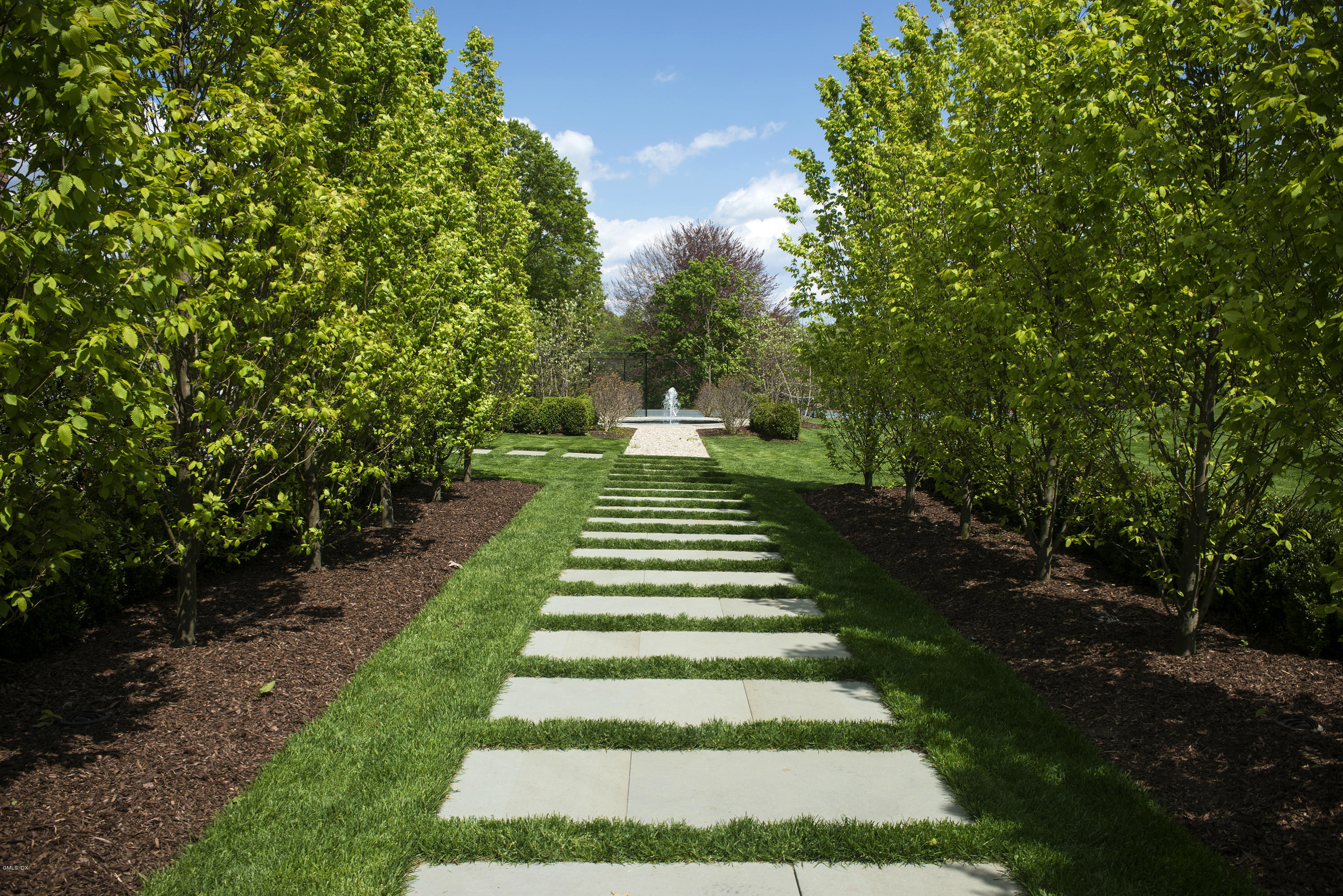 547 Lake Avenue Greenwich, CT 06830 - Photo 22 of 26 a view of a yard with flower plants