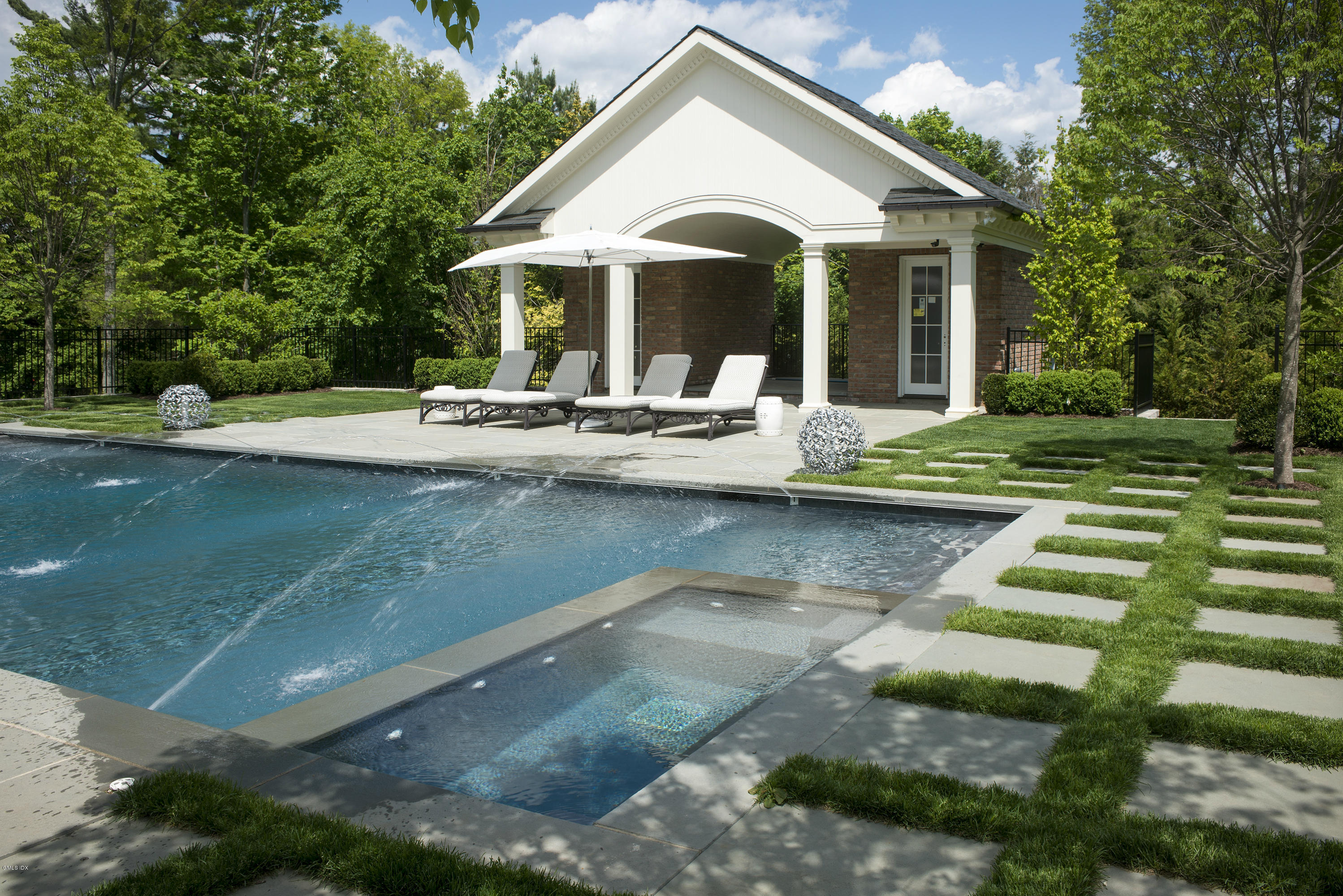 547 Lake Avenue Greenwich, CT 06830 - Photo 24 of 26 a view of house with swimming pool and outdoor seating