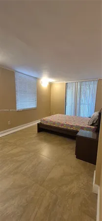 a bedroom with a bed and a cabinets