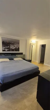 a bedroom with a bed and a mirror