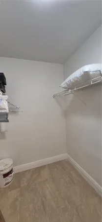 a view of a room with racks on the wall