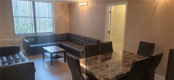 a living room with furniture and a window