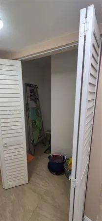 a view of an empty room with stairs