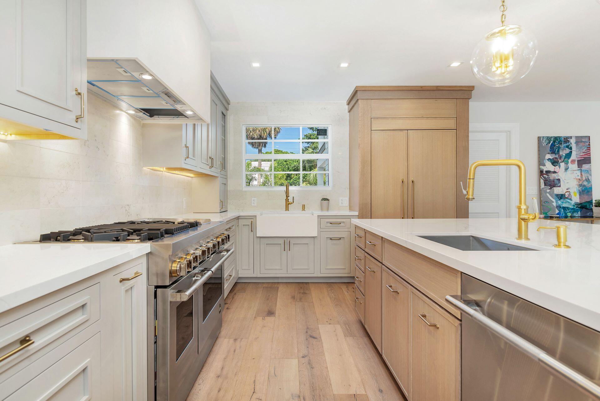 231 Argyle Road West Palm Beach, FL 33405 - Photo 11 of 41 a kitchen with a stove and a sink