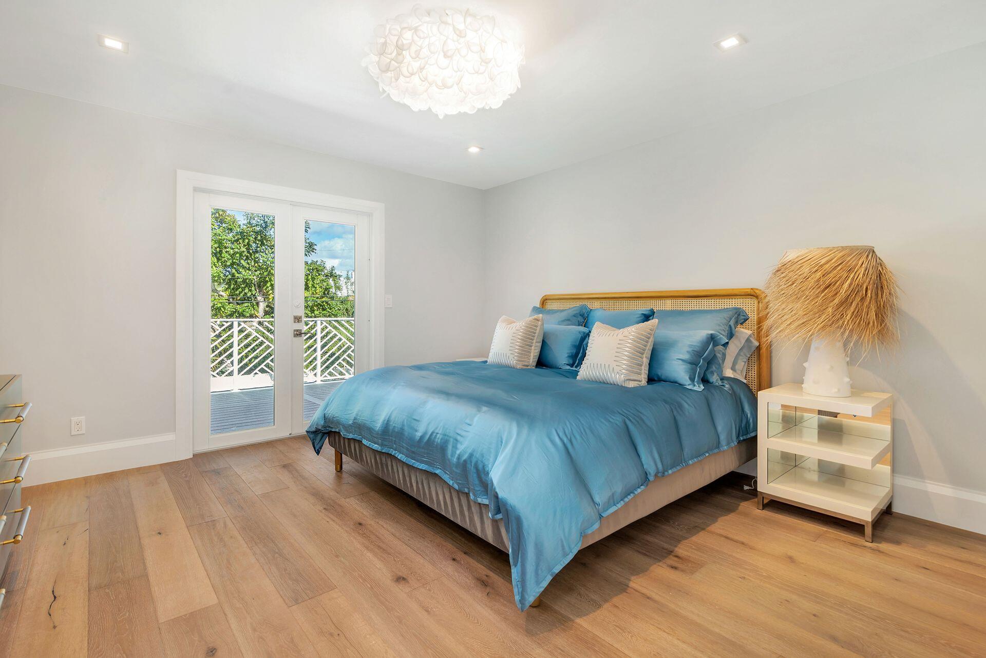 231 Argyle Road West Palm Beach, FL 33405 - Photo 14 of 41 a bedroom with a bed and a window