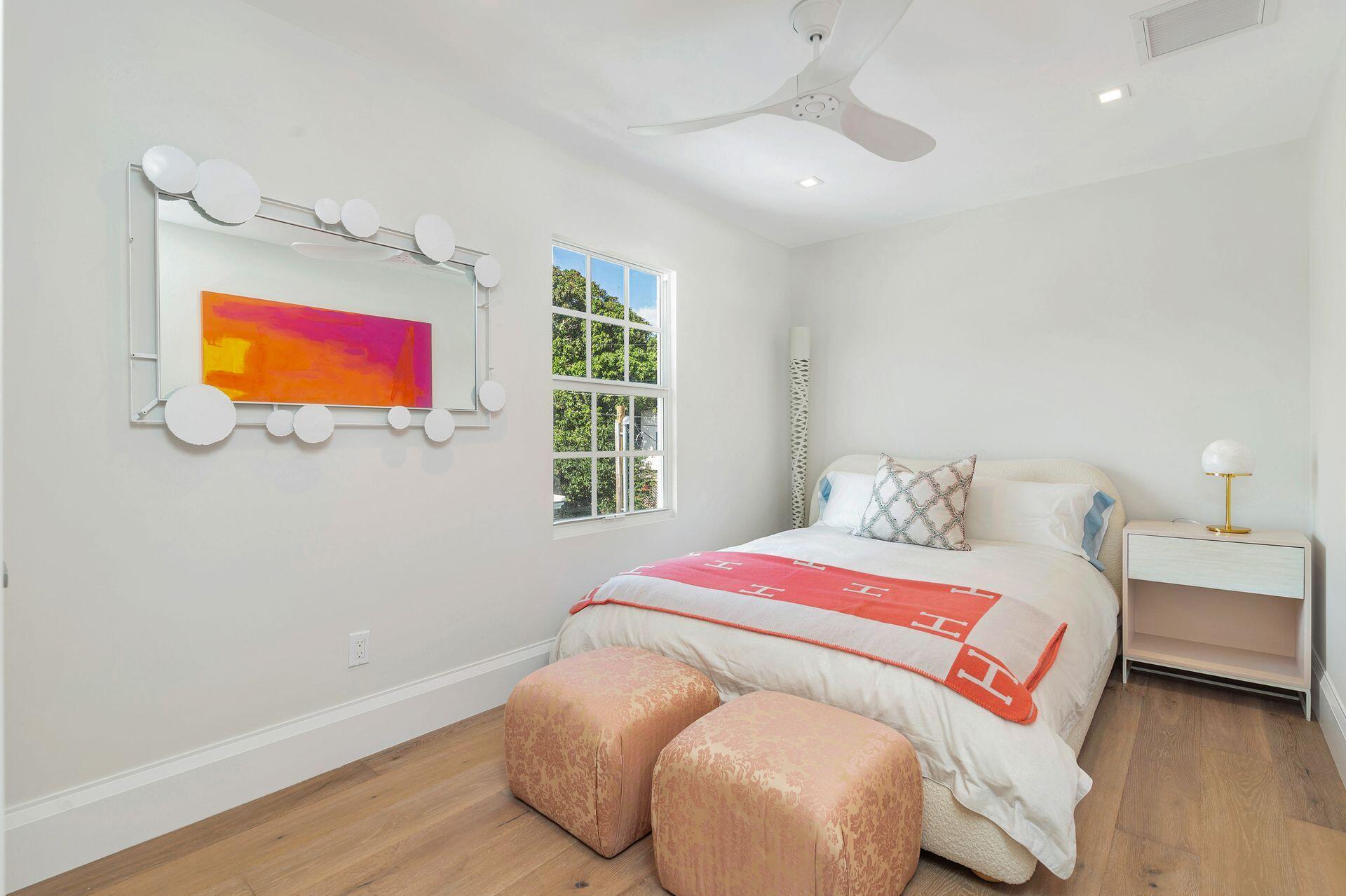 231 Argyle Road West Palm Beach, FL 33405 - Photo 22 of 41 a bedroom with a bed and a flat screen tv