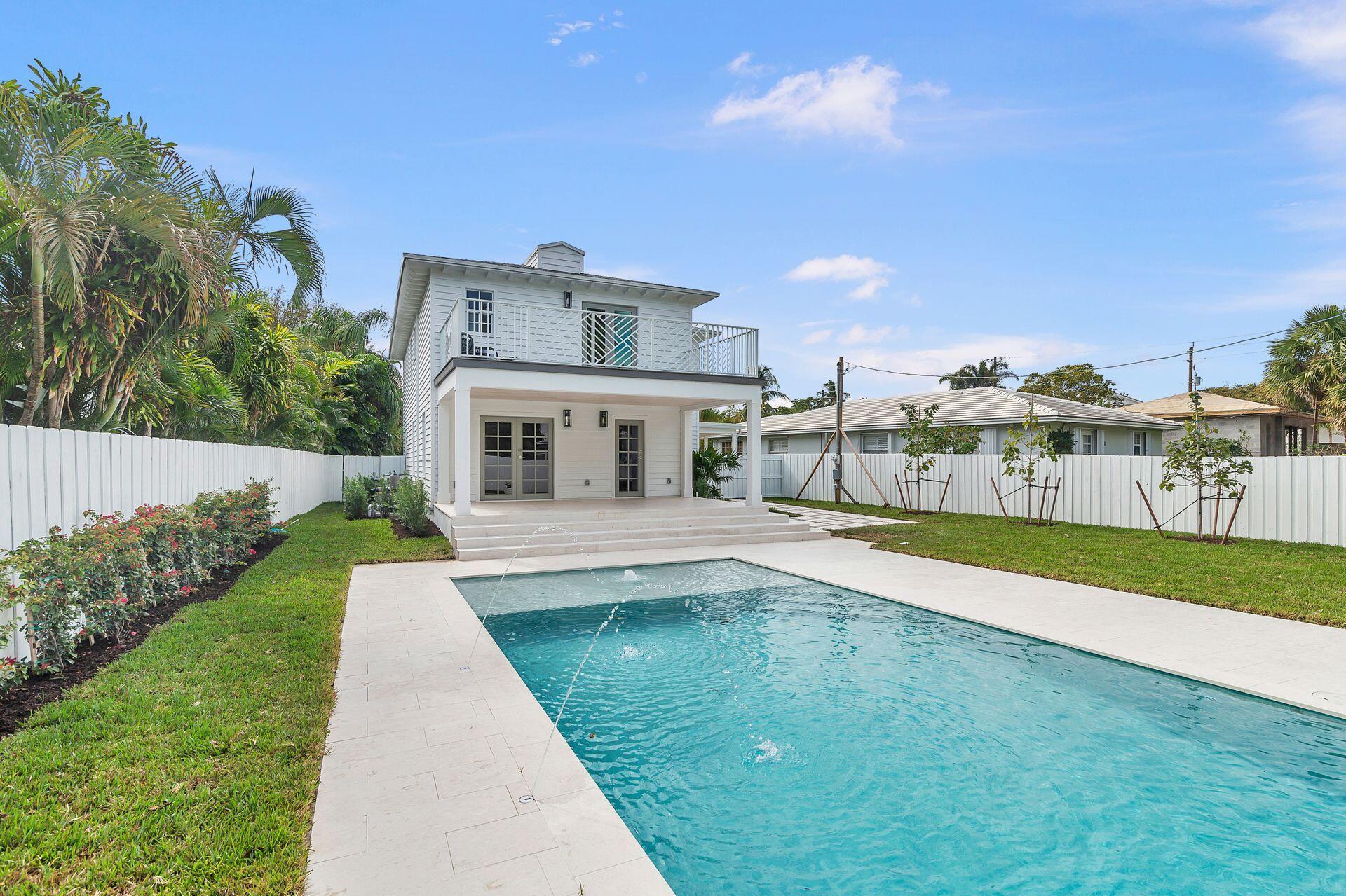 231 Argyle Road West Palm Beach, FL 33405 - Photo 27 of 41 a view of house with swimming pool and yard in the background