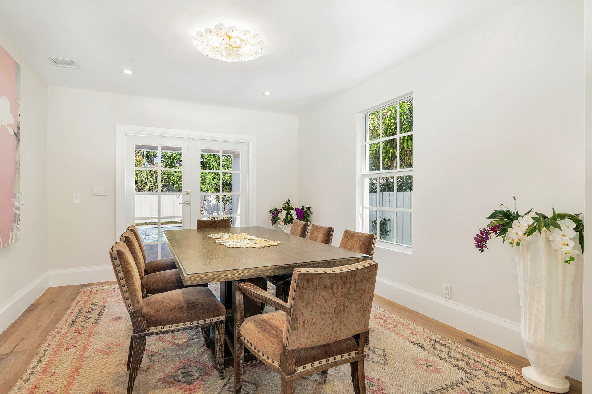 231 Argyle Road West Palm Beach, FL 33405 - Photo 8 of 41 a view of a dining room with furniture and a potted plant