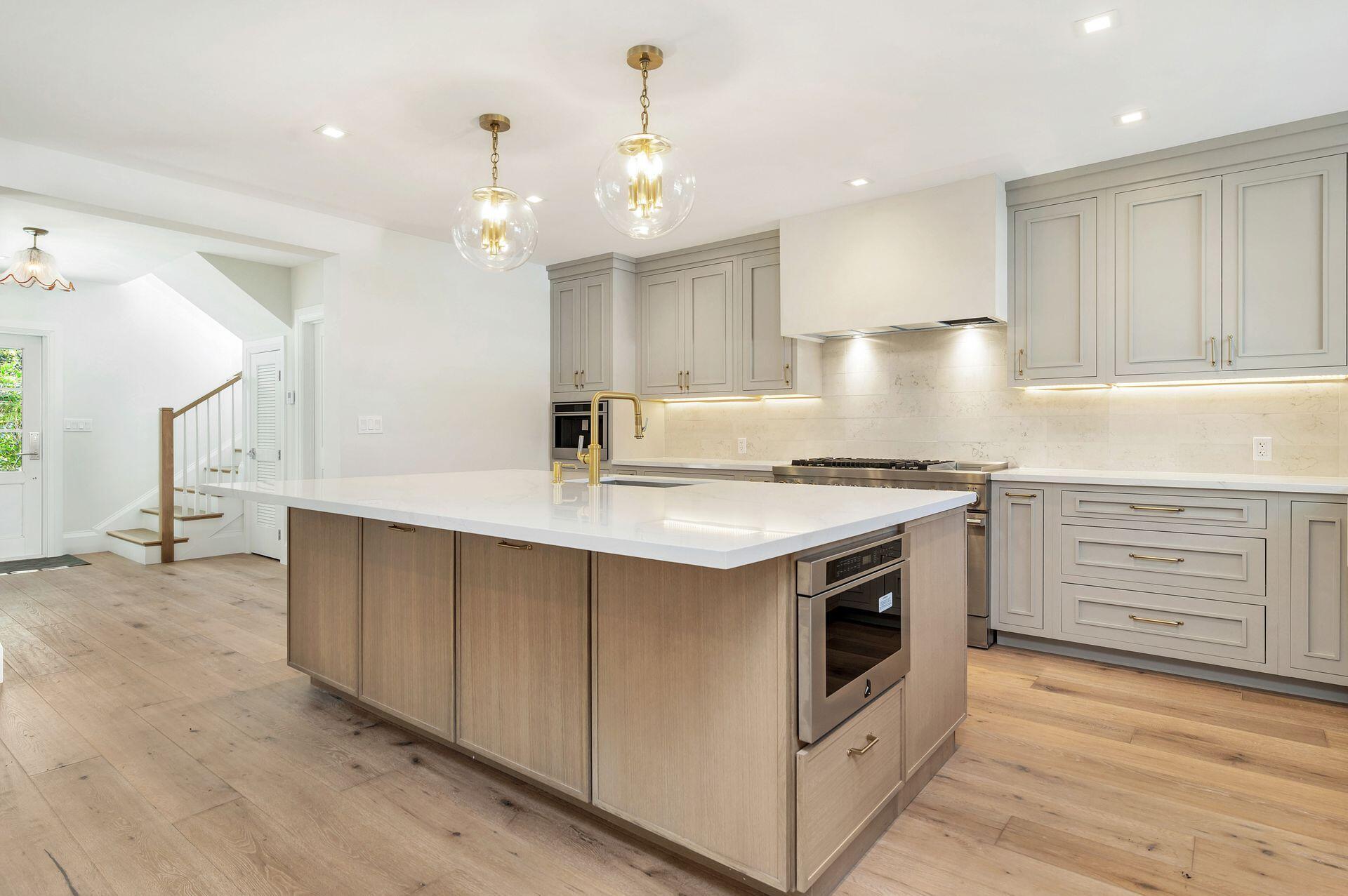 231 Argyle Road West Palm Beach, FL 33405 - Photo 9 of 41 a kitchen with stainless steel appliances granite countertop a stove a sink and a refrigerator
