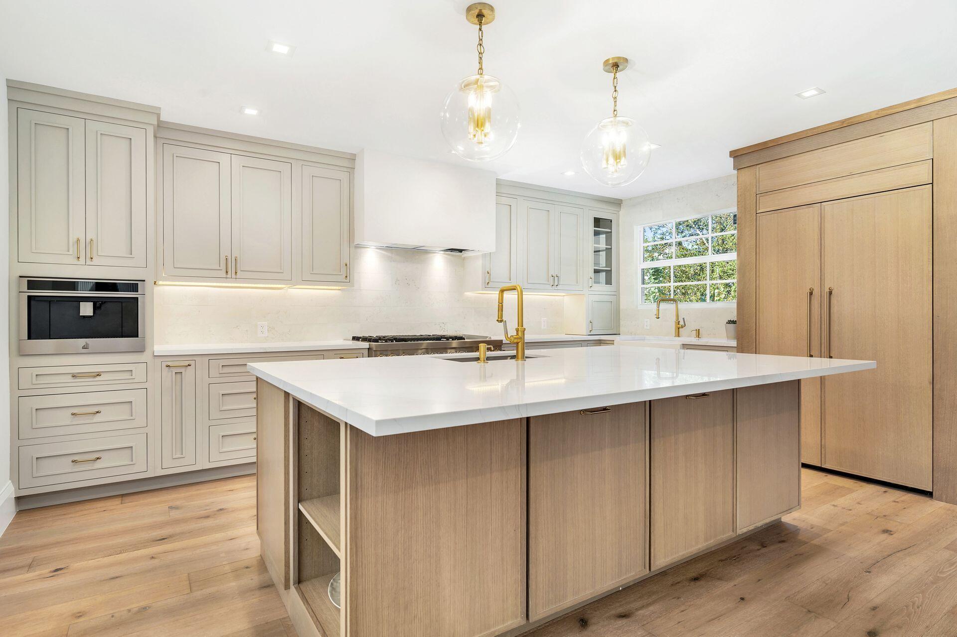 231 Argyle Road West Palm Beach, FL 33405 - Photo 10 of 41 a kitchen with kitchen island granite countertop a sink appliances cabinets and counter space