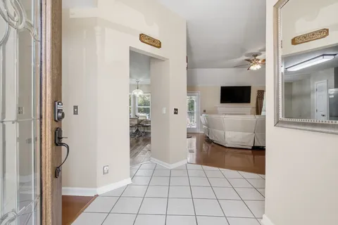 a view of an entryway and livingroom with furniture