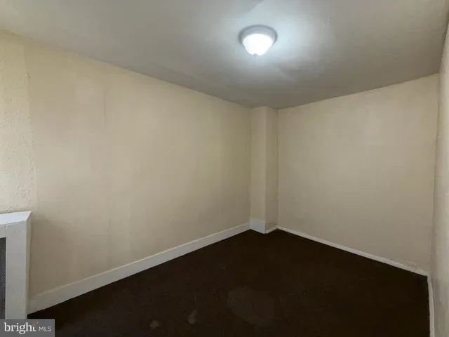 an empty room with a empty space and a window