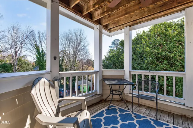 a view of a two chairs in the balcony