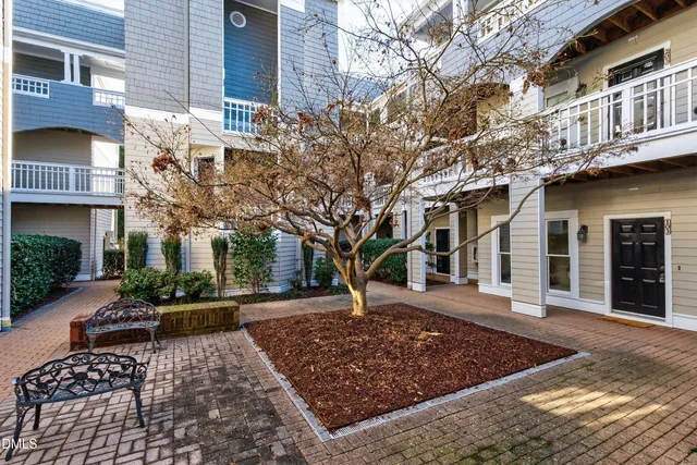 a view of a building with a yard