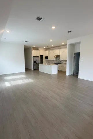 a view of a kitchen with kitchen island and a window