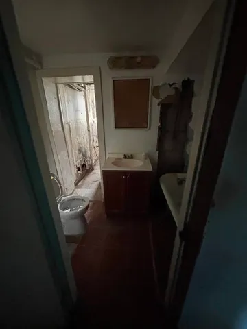a bathroom with a sink a mirror and a bathtub