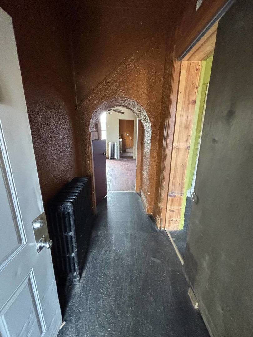 3316 West Maypole Avenue Chicago, IL 60624 - Photo 18 of 40 a view of entryway and hallway with wooden floor