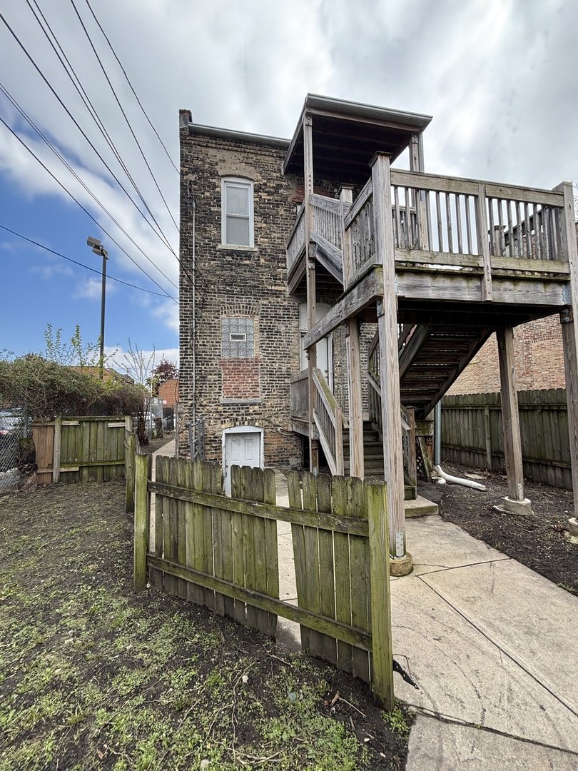 3316 West Maypole Avenue Chicago, IL 60624 - Photo 2 of 40 a view of a house with wooden deck
