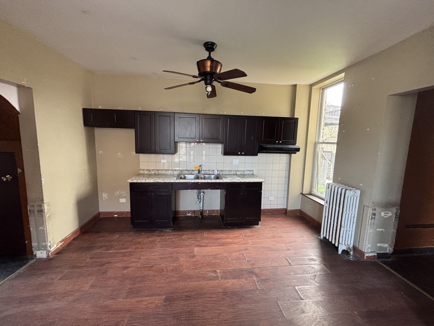 3316 West Maypole Avenue Chicago, IL 60624 - Photo 22 of 40 a kitchen with a refrigerator and a sink