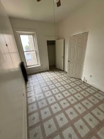 a bedroom with a bed and cabinets