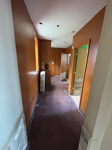 a view of a livingroom with furniture and a window