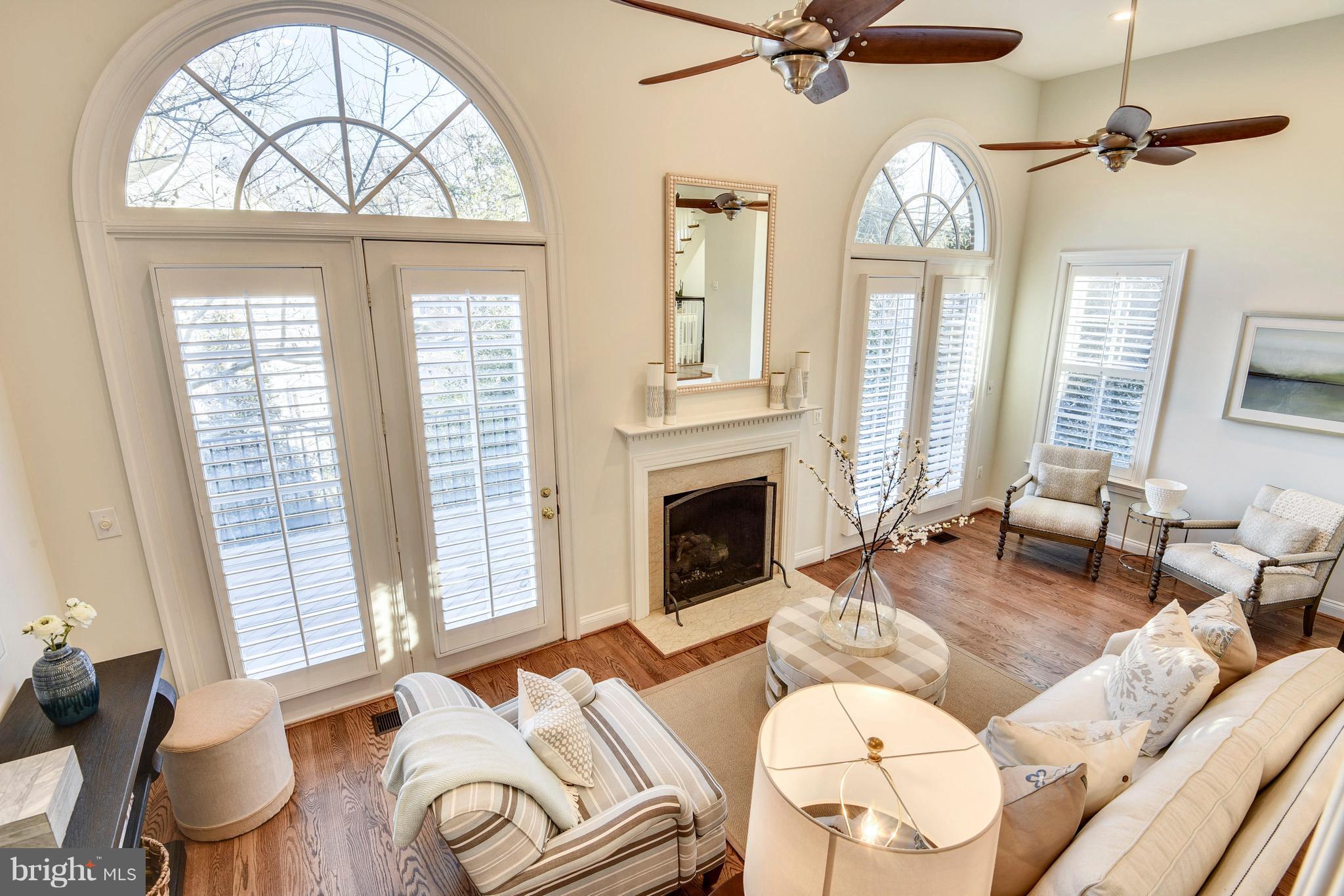 8501 Halston Way Bethesda, MD 20814 - Photo 12 of 29 Two Doors Leading to Deck, Gas Fire Place