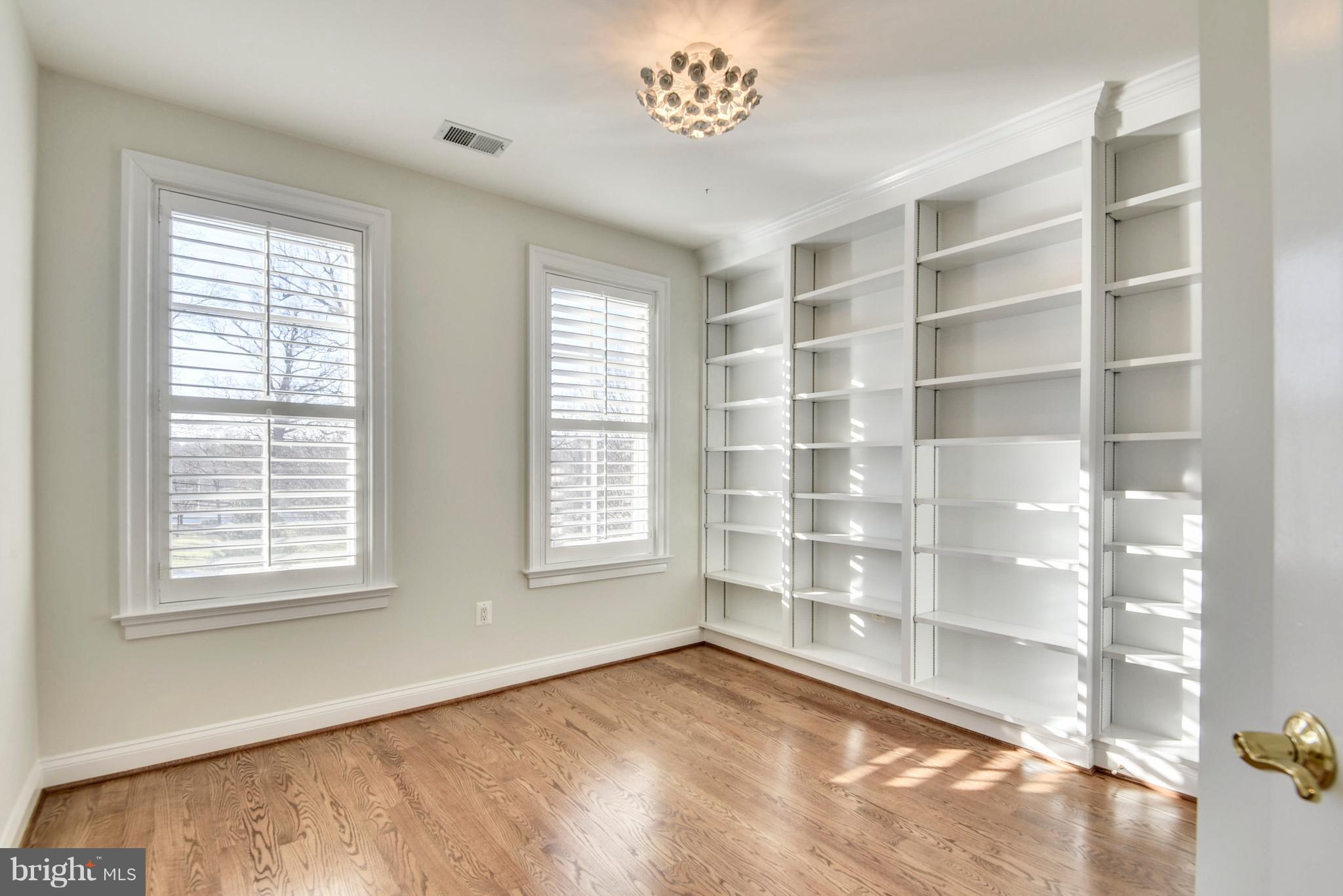 8501 Halston Way Bethesda, MD 20814 - Photo 20 of 29 Bedroom #3 W/custom book shelving, hardwood floors