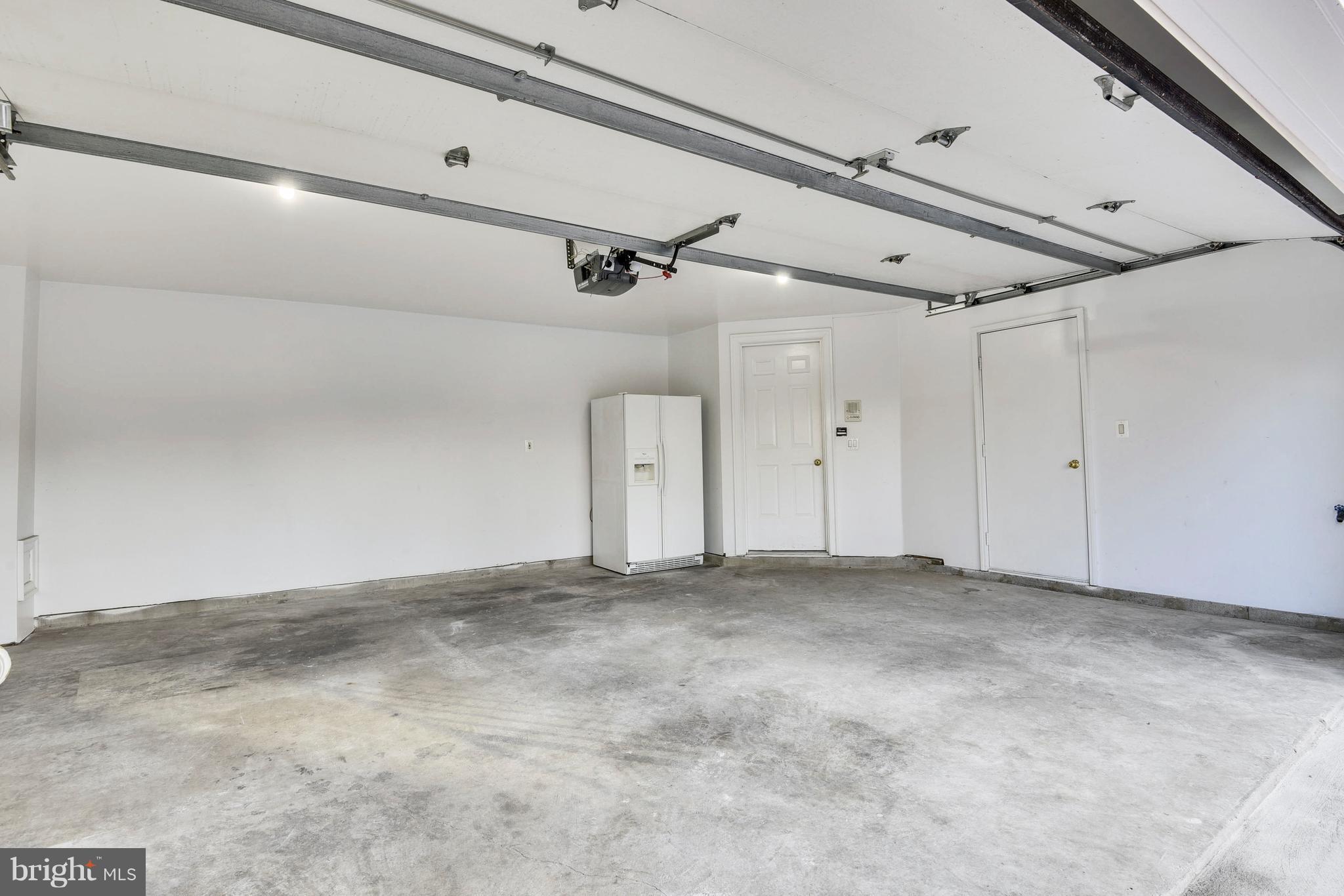 8501 Halston Way Bethesda, MD 20814 - Photo 28 of 29 2 Car Garage with Extra Storage room under Stairs