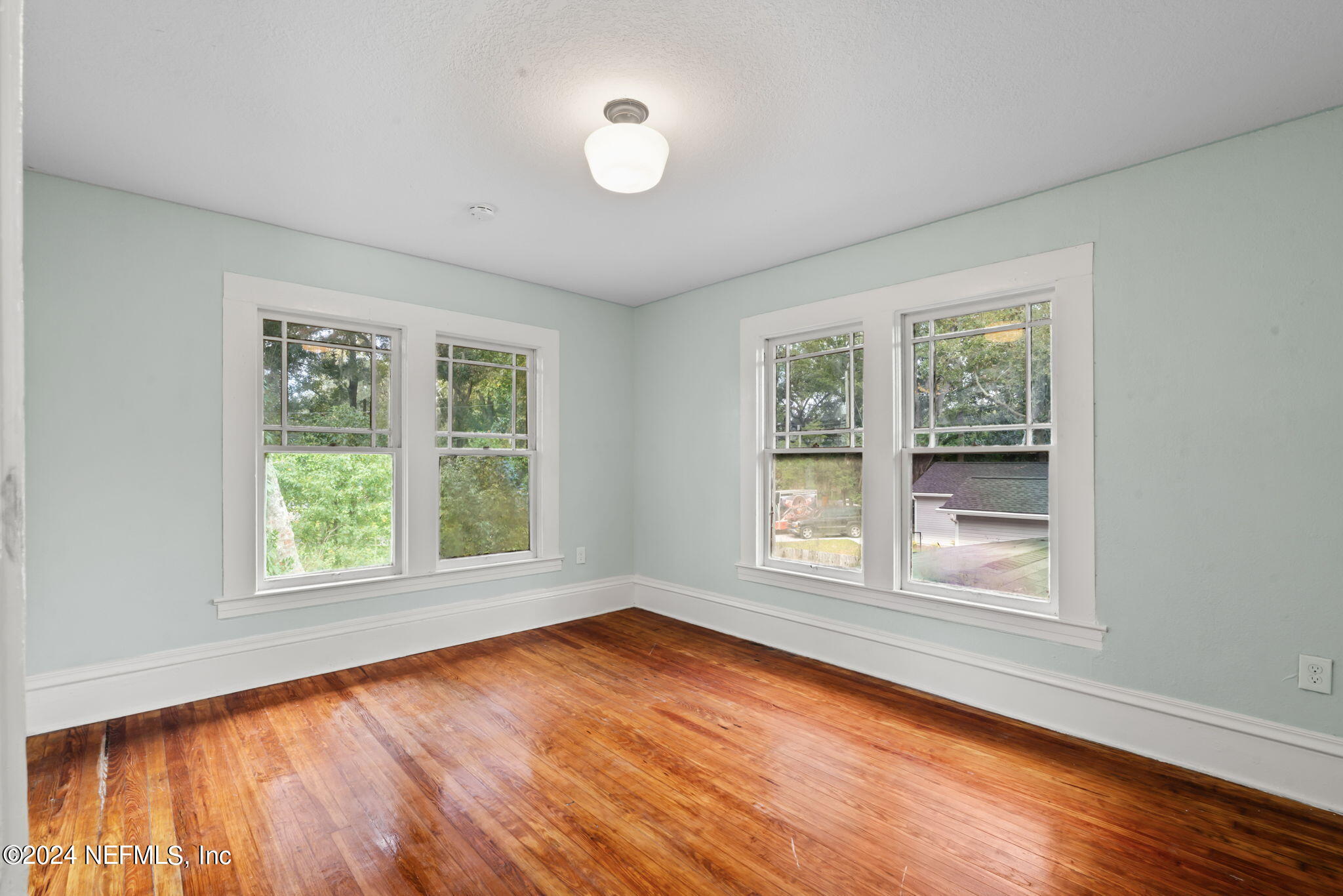 33 River Road Orange Park, FL 32073 - Photo 50 of 81 a view of an empty room with wooden floor and a window