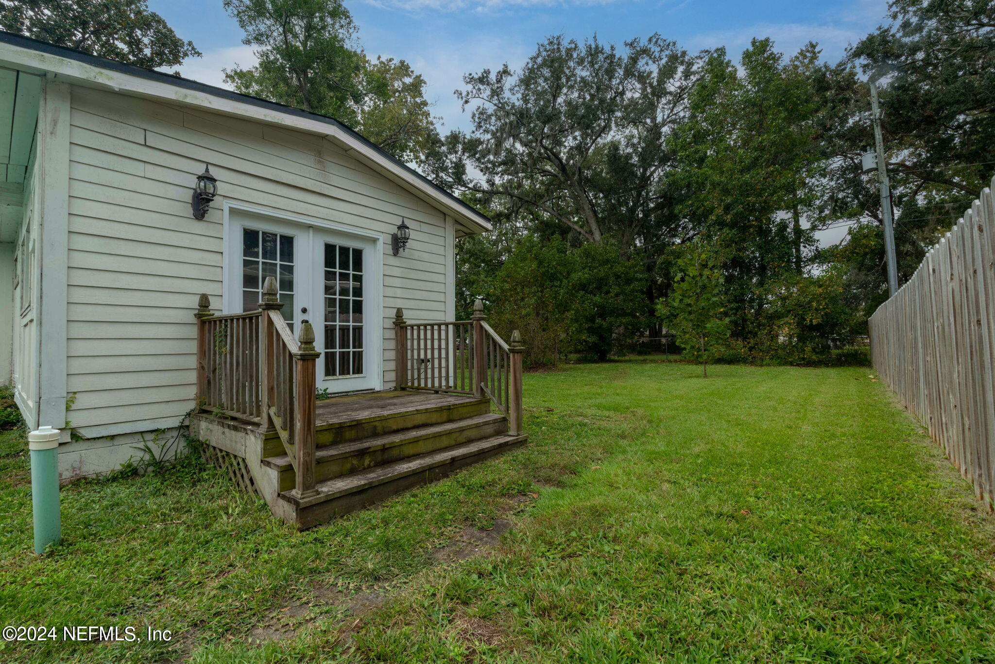 33 River Road Orange Park, FL 32073 - Photo 61 of 81 a view of backyard with wooden fence and a large tree