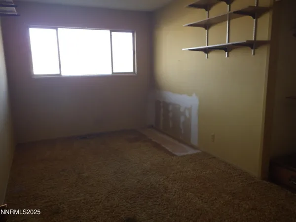 a view of a room with a window