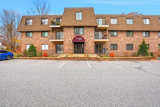 a front view of a building with street view