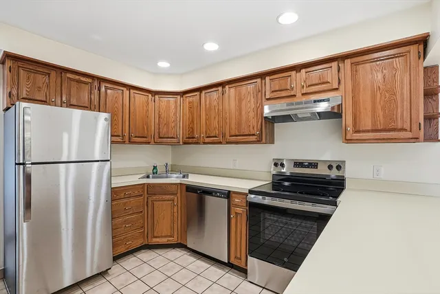 a kitchen with a stove and a sink