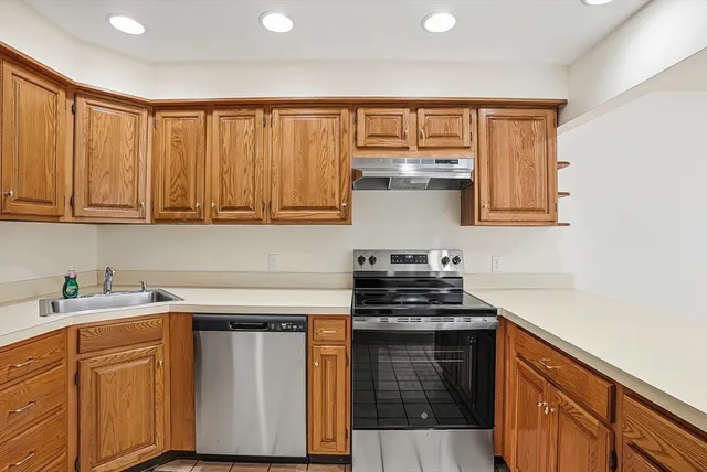 a view of room with wooden floor and entryway