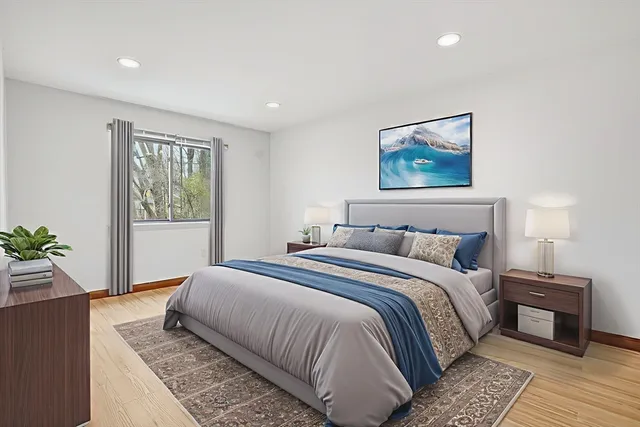 a bedroom with a large bed and a couch