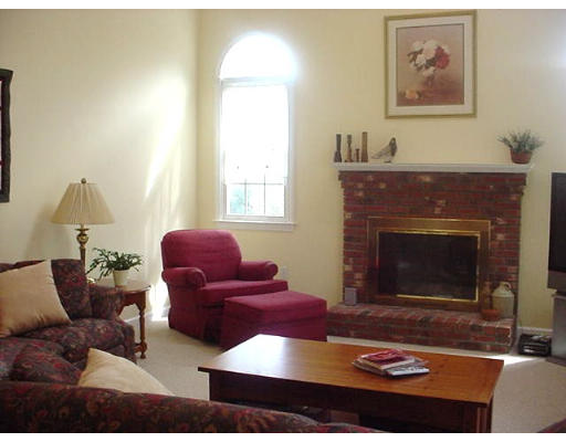 140 O'Malley Road Marlborough, MA 01752 - Photo 12 of 19 a living room with furniture and a fireplace