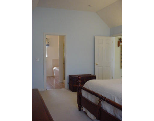 140 O'Malley Road Marlborough, MA 01752 - Photo 16 of 19 a bedroom with a bed and a potted plant