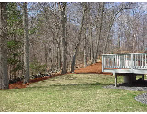 140 O'Malley Road Marlborough, MA 01752 - Photo 4 of 19 a backyard of a house with table and chairs
