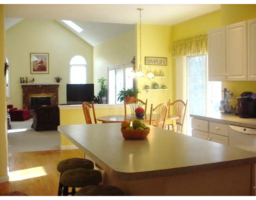 140 O'Malley Road Marlborough, MA 01752 - Photo 8 of 19 a kitchen with a sink a counter and chairs