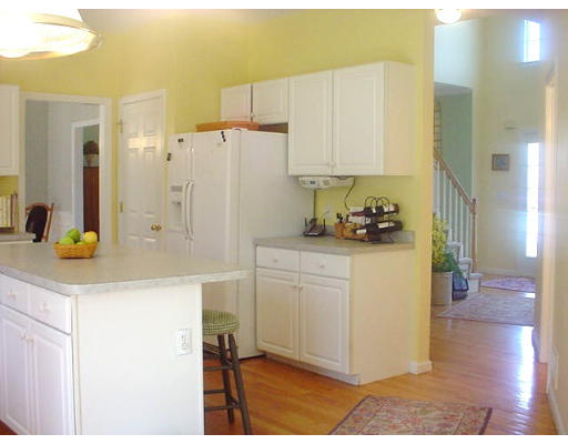 140 O'Malley Road Marlborough, MA 01752 - Photo 10 of 19 a kitchen with stainless steel appliances white cabinets and a refrigerator