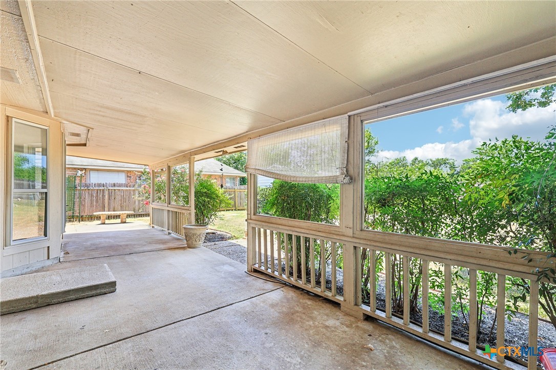 303 North Kings Canyon Drive Cedar Park, TX 78613 - Photo 13 of 24 a view of a porch with furniture and floor to ceiling window