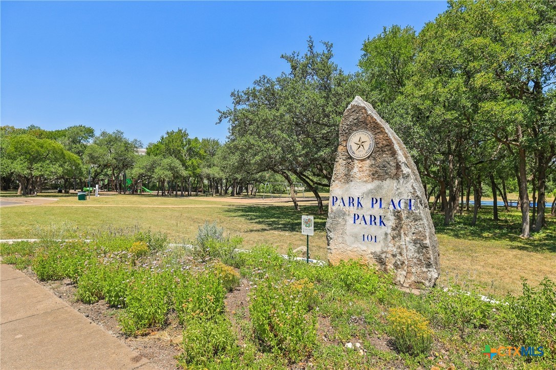 303 North Kings Canyon Drive Cedar Park, TX 78613 - Photo 19 of 24 a view of a park with a bench and trees around