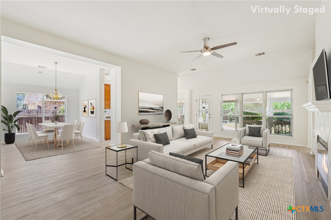303 North Kings Canyon Drive Cedar Park, TX 78613 - Photo 4 of 24 a living room with furniture or outdoor view and a large window